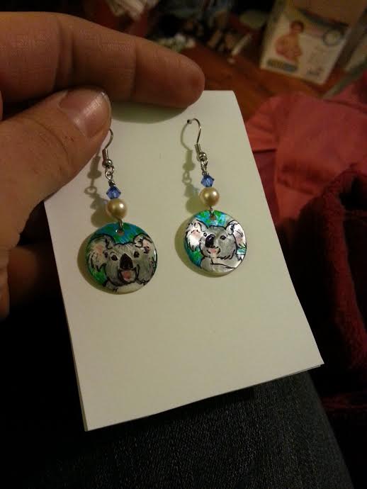 koala earrings on shell